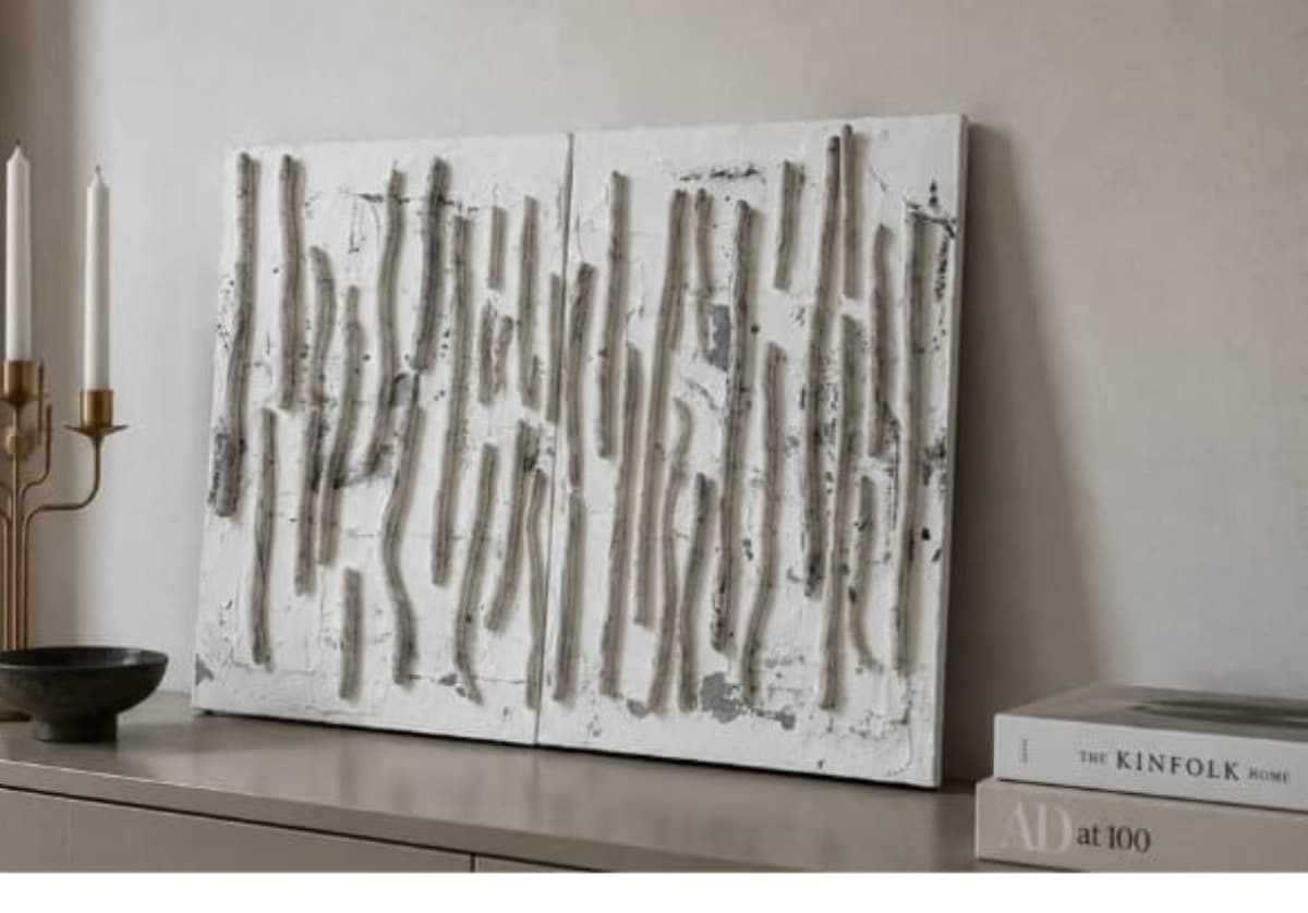 Three Verses: a white diptych of vertical organic strokes, styled in an interior